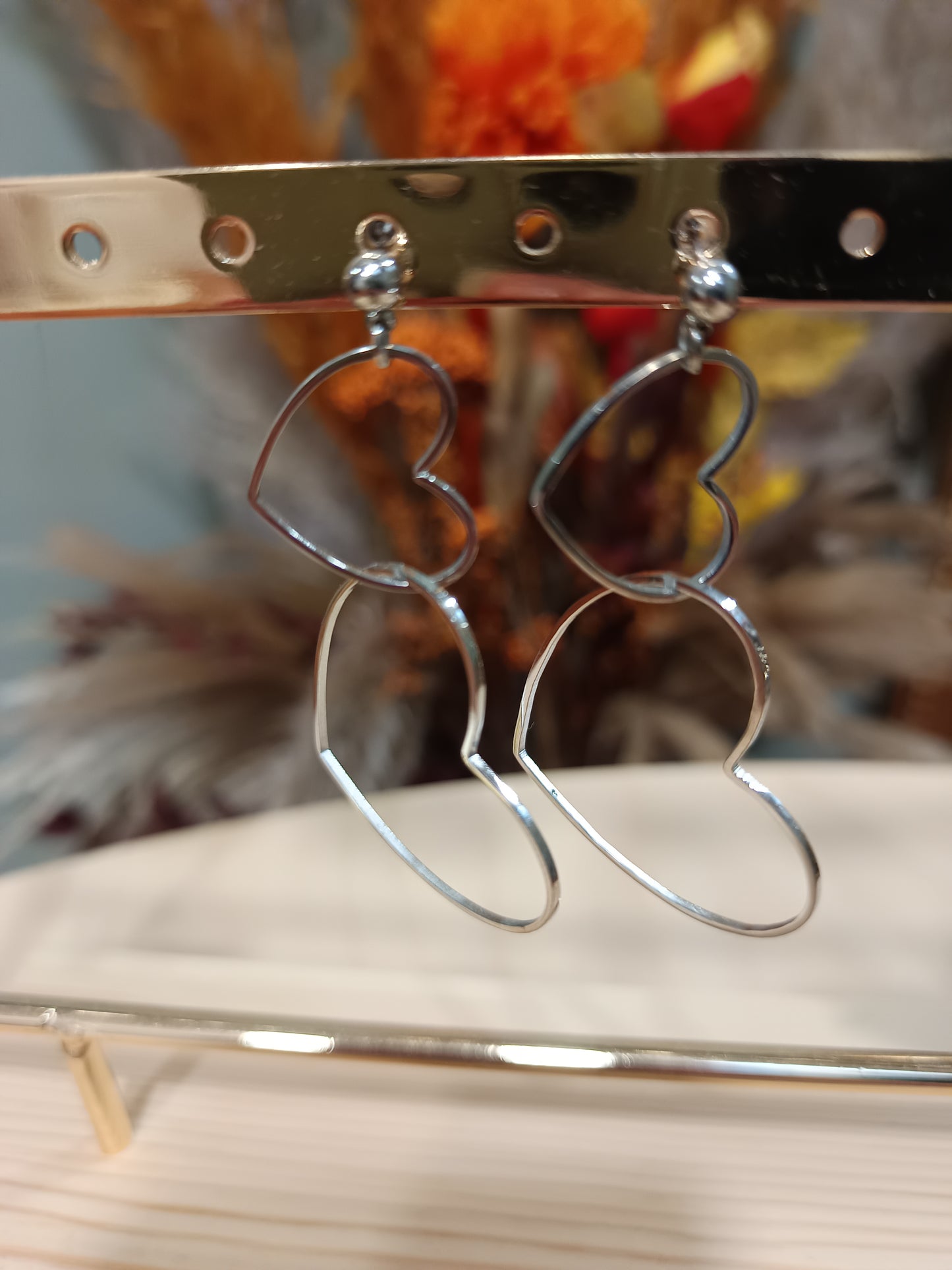Boucles d'oreilles double coeur argenté